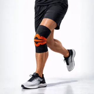 Kompressions Kniebandage für Sport orange schwarz stabilisierende Kniegelenkbandage. laufschritt